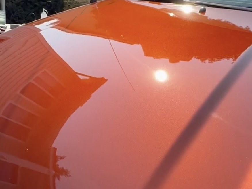 Paint correction before and after example: swirl marks reduced and reflection improved