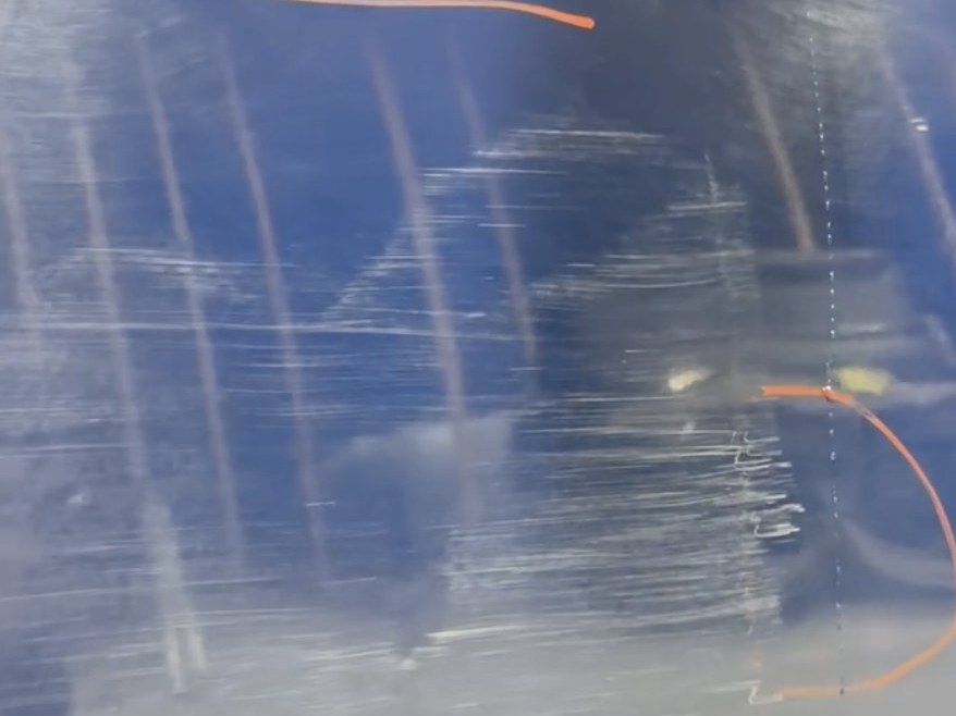 Paint damage before correction: heavy scratching and haze